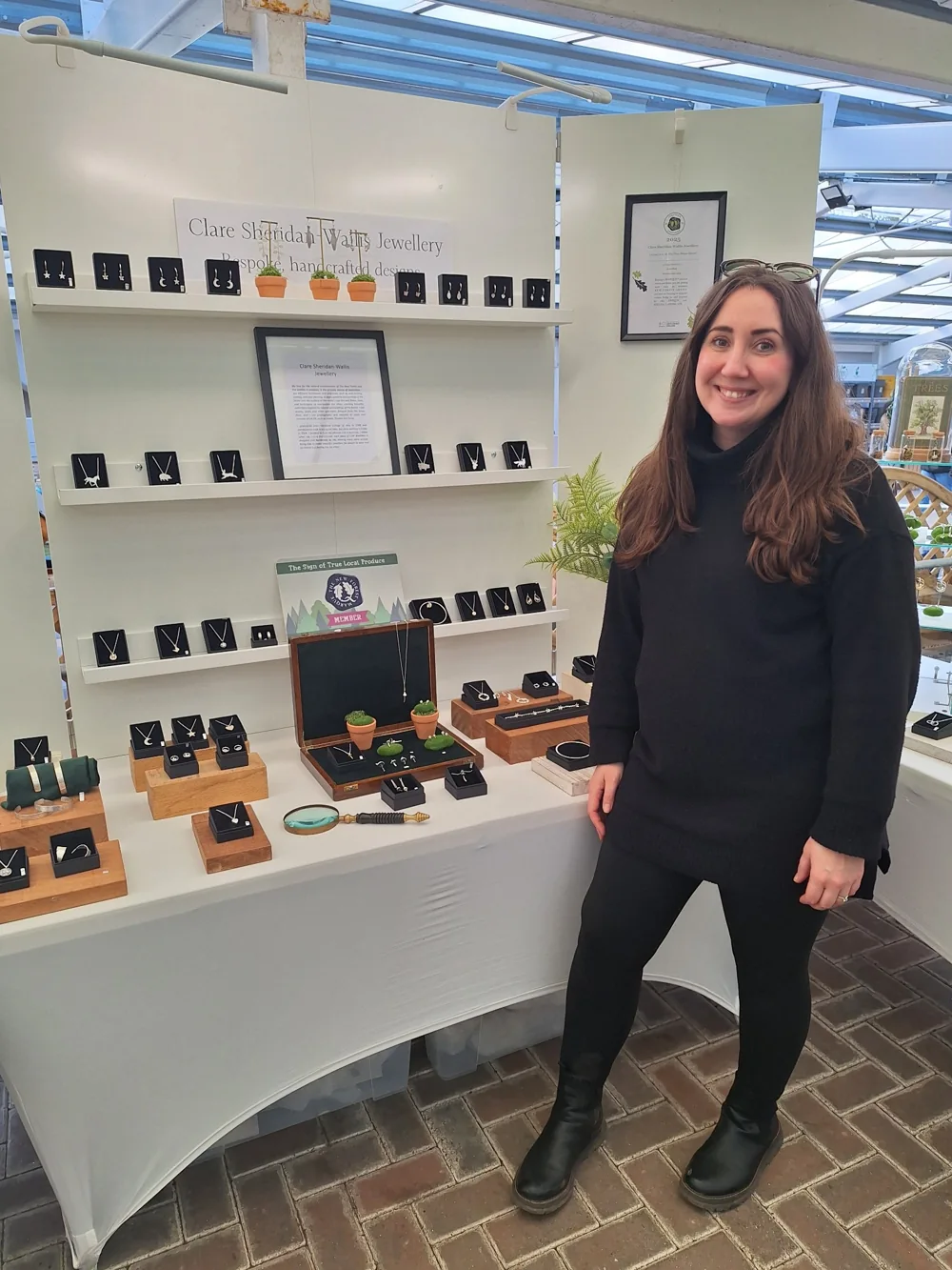 Clare Sheridan-Wallis beside her jewellery display