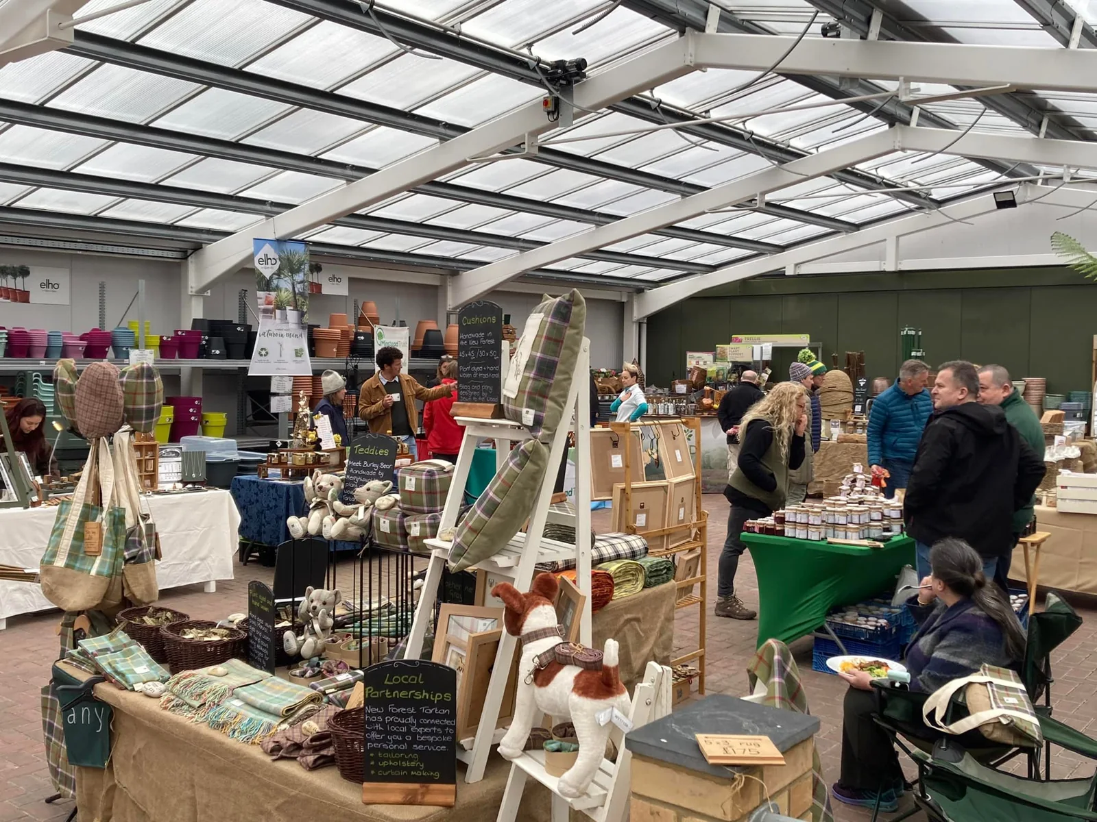 Visitors browsing local craft stalls at a previous New Forest Marque market