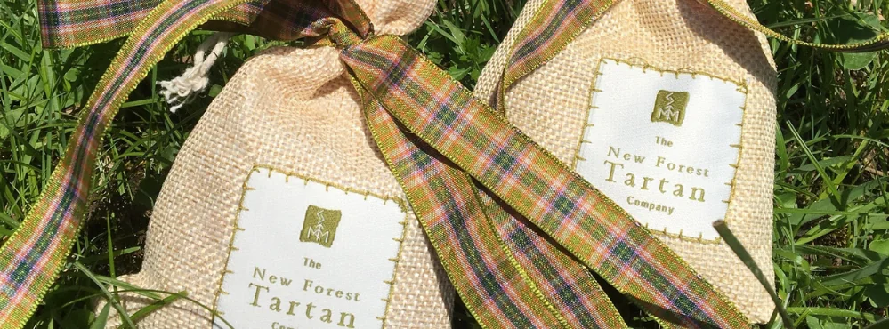 Gift bags tied with colourful New Forest tartan ribbon