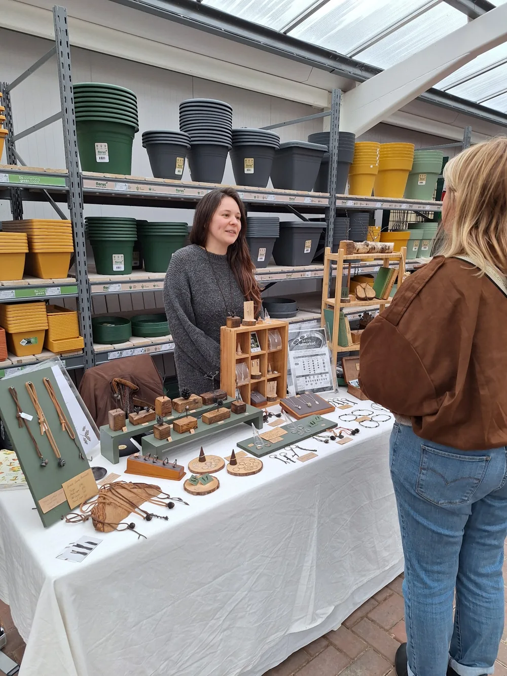 Rosie Wesley showing her jewellery and metalwork at a market